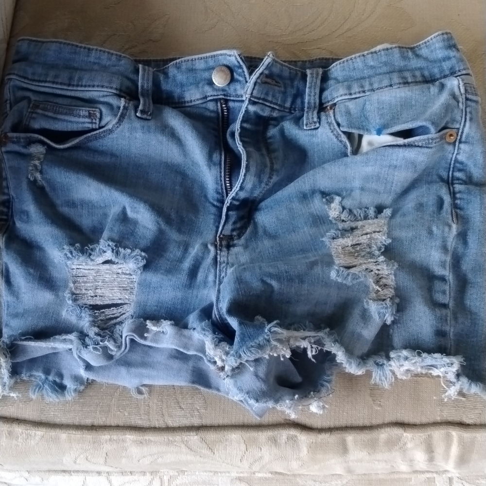 Women's ripped blue jean cut off jean shorts light blue